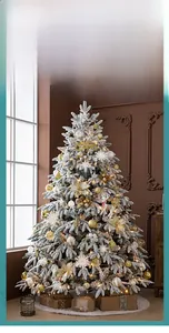 Luxurious flocked Christmas tree with golden ornaments, white tree skirt, and gift boxes