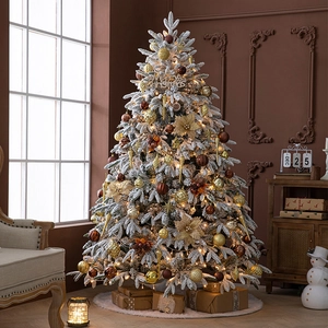 Premium flocked artificial Christmas tree with warm LED lights and elegant gold ornaments