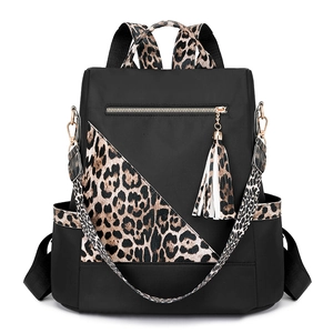 Classic black leopard print backpack for women with stylish gold hardware and tassel detail