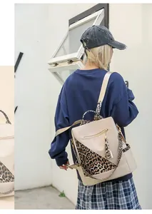 Detail of leopard print backpack with PU leather拼接 and stylish fringe tassel accent