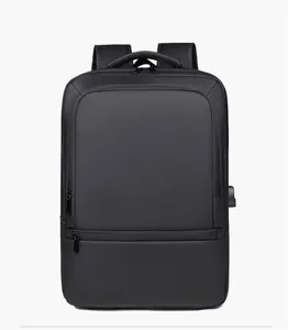 Front view of black business backpack showing external USB port and waterproof fabric