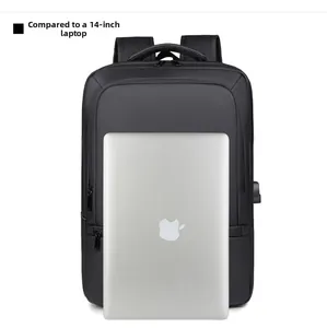 Business laptop backpack shown next to a 14-inch silver laptop for size comparison