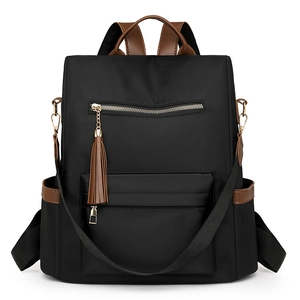 Fashionable black large capacity women's backpack with brown leather trim and tassels