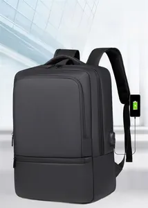 Detail of waterproof business backpack showing external USB charging port and matte fabric