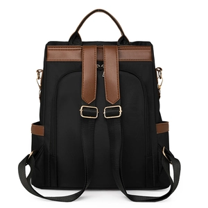 Detail view of water-resistant nylon backpack featuring back anti-theft zipper pocket