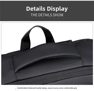 Detail of the thickened padded handle on a black business travel backpack for comfort