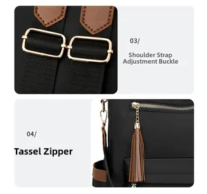 Detail of gold-tone adjustment buckle and brown tassel charm on black nylon backpack