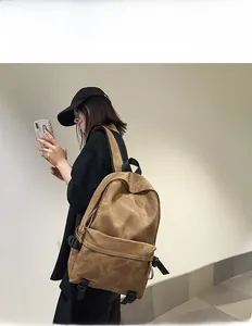 Close-up of retro brown backpack with multiple compartments and vintage texture