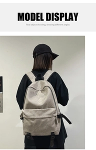 Rear view of a khaki street style backpack with large capacity and buckle details