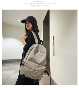 Detailed view of durable beige street style backpack with multiple compartments and straps