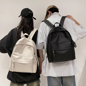 Rear view of minimalist large-capacity student backpacks in beige and black colors