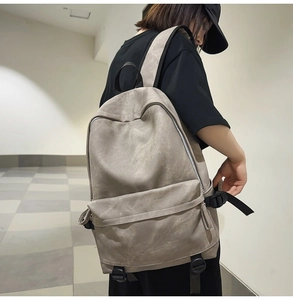 Side view of a vintage canvas backpack on a person highlighting large capacity and comfort
