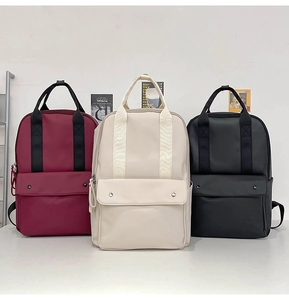 Minimalist large capacity backpacks in burgundy, cream and black with metal snaps
