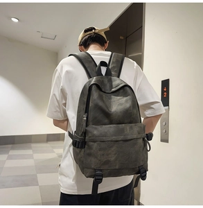 Detail view of large capacity street style backpack with front zipper and side buckles