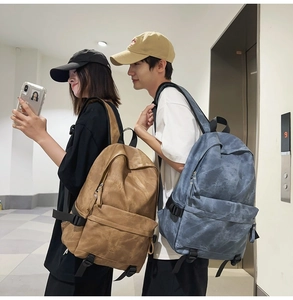 Detail view of large capacity street style backpacks with retro matte texture and pockets