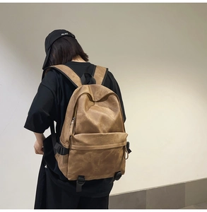 Retro brown streetwear backpack with large front pocket and buckle strap details