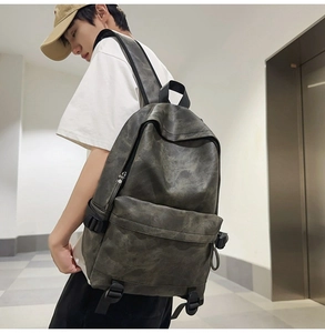 Detailed view of large capacity backpack with vintage textured fabric on a model