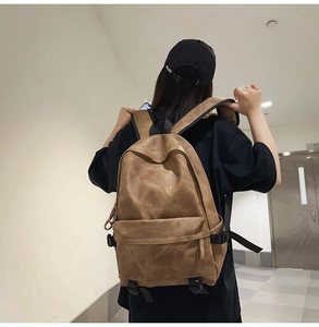 Close-up of brown vintage leather backpack with large capacity and durable nylon straps