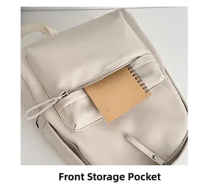Detailed view of the front zipper pocket on this beige PU leather school backpack
