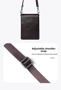 Detail of adjustable nylon strap and bronze buckle on dark brown leather crossbody bag