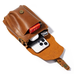 Vintage crazy horse leather belt pouch showing EDC storage for phone and accessories