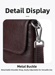 Detail of vintage metal hook and adjustable woven strap on dark brown leather bag