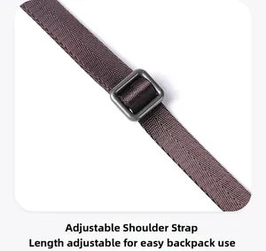 Detail of adjustable nylon shoulder strap with metallic buckle for leather crossbody bag