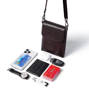Deep brown vegetable tanned leather mobile bag with flap design and adjustable strap