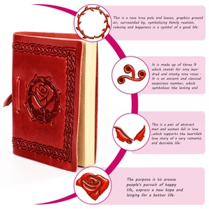 Close-up of red leather cover with embossed rose and Celtic patterns on a handmade notebook