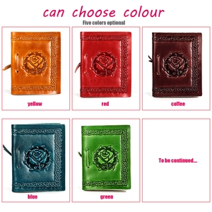 Detail view of five different colors of vintage leather notebooks with rose embossing