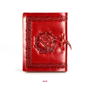Detailed back view of vintage red genuine leather notebook with embossed rose pattern