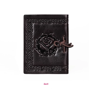 Macro view of the back leather cover featuring embossed rose and Celtic woven border