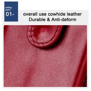 Macro detail of durable dark red cowhide leather showing tight stitching and grain texture