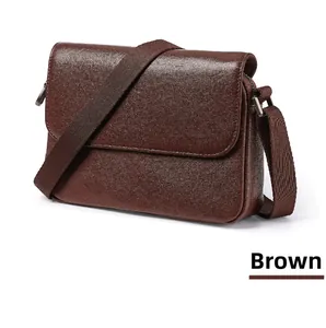 Close-up of brown vegetable tanned leather texture and durable metal D-ring buckle