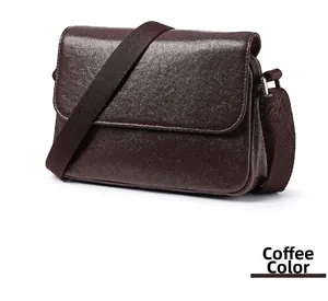 Detailed front view of coffee brown leather messenger bag with wide shoulder strap