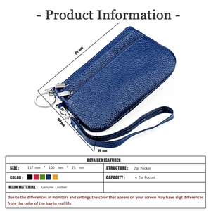 Detail of navy blue genuine leather wristlet purse with 4 zipper pockets and metal key ring