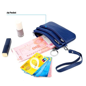 Blue genuine leather wristlet wallet featuring three zip pockets for cash and lipstick
