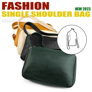 Detail of leather shoulder bags in green, black, cream, and yellow with litchi texture