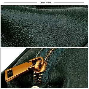 Detailed macro view of dark green lychee grain leather texture and gold metal zipper