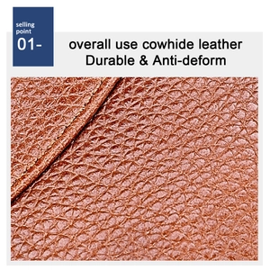 Detail of durable brown cowhide leather with lychee texture and precision stitching