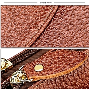 Close-up of brown litchi pattern leather grain and gold zipper hardware on crossbody bag