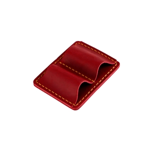 Macro shot of dark red leather double pen case featuring yellow hand-stitched detailing