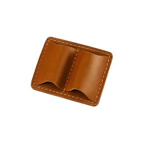 Close-up of vintage brown leather pen sleeve featuring double slots and fine stitching