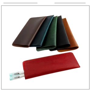Detailed view of handmade crazy horse leather sunglasses cases in multiple retro colors