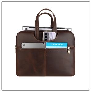 Detail view of genuine leather laptop bag with double handles and front zipper pocket