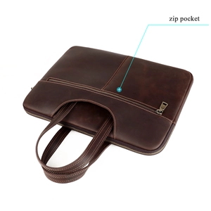 Detail of the exterior zip pocket on a dark brown crazy horse leather laptop briefcase