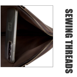 Detail view of the brown leather MacBook Pro sleeve with gold zipper and fabric lining