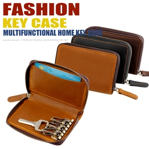 Internal detail of leather key case with six metal hooks and a card slot