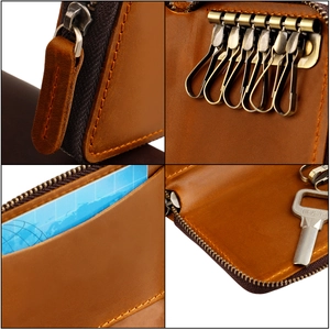 Detail of brown leather key case featuring six hooks and internal card slot design