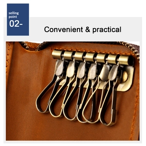 Macro detail of brown leather key case interior showing six vintage metal hooks and zipper